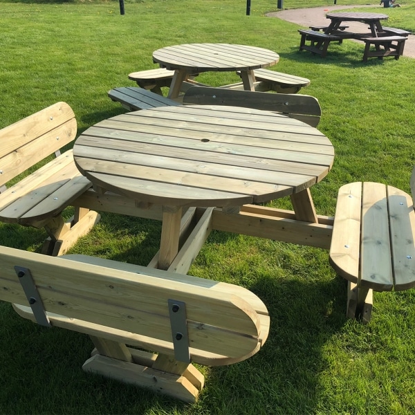 Round wooden picnic table with seat backs