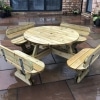 Traditional pub style picnic table with seatbacks and rounded edges in wet courtyard