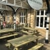 Pub style 8 seater timber picnic bench in outdoor pub venue