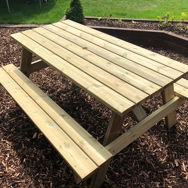 8 seater A-frame wooden picnic bench in outdoor setting