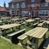 Wooden walk in picnic tables for 8 people in am putdoors pub garden