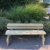 Long timber park style bench with rounded edges and back rest near an outdoor car park