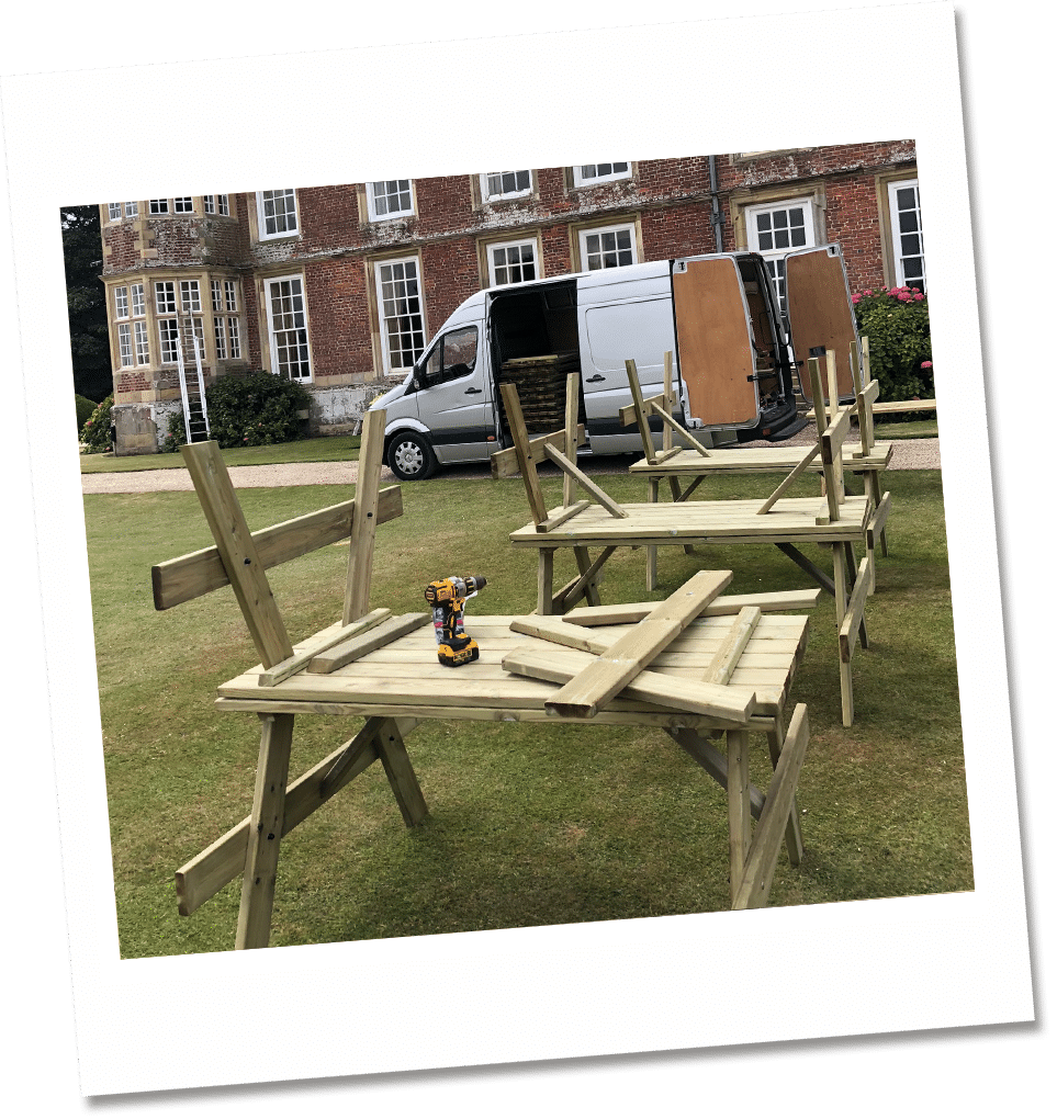A-frame 6-seater picnic table being assembled outside a school