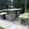 Contemporary wooden picnic bench with stone filled galvanised steel gabions with matching benches