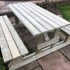 H-frame 8 seater walk in picnic bench in courtyard